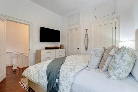 a bedroom with bed and a window