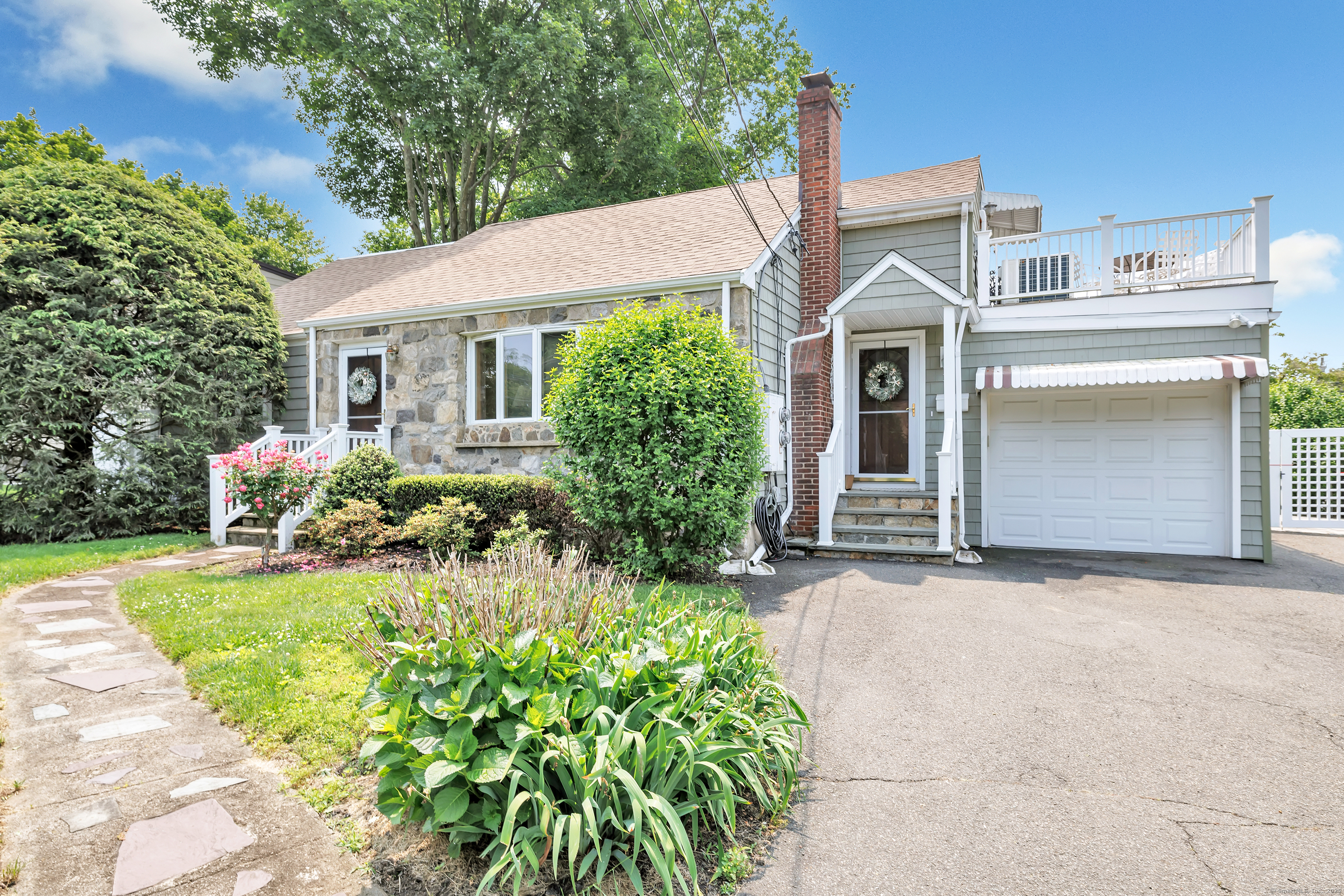 16 Senga Road Norwalk, CT 06854 - Photo 1 of 1 front view of a house with a yard
