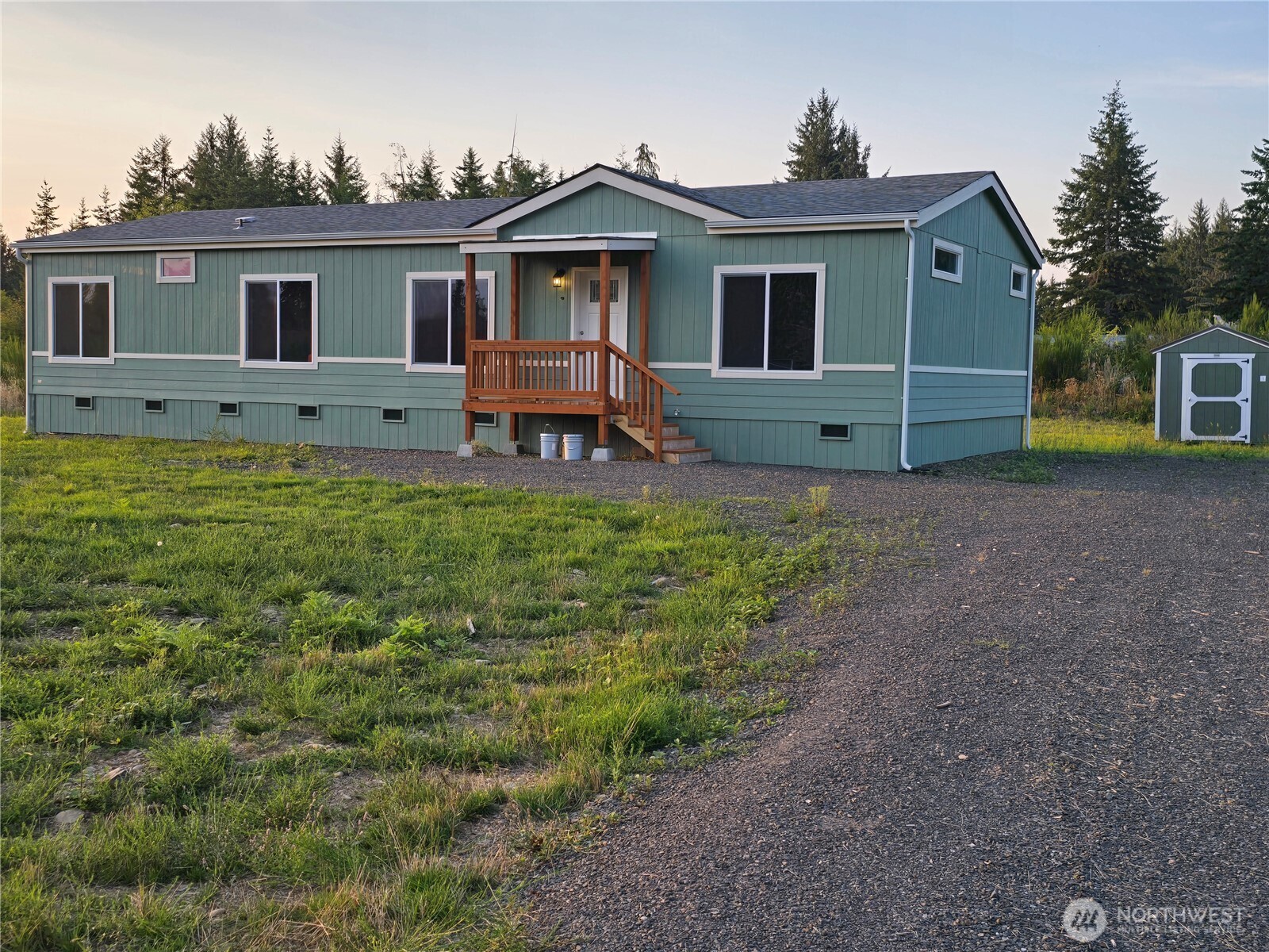 53 Newton Rd Forks Forks, WA 98331 - Photo 2 of 25 a front view of a house with garden