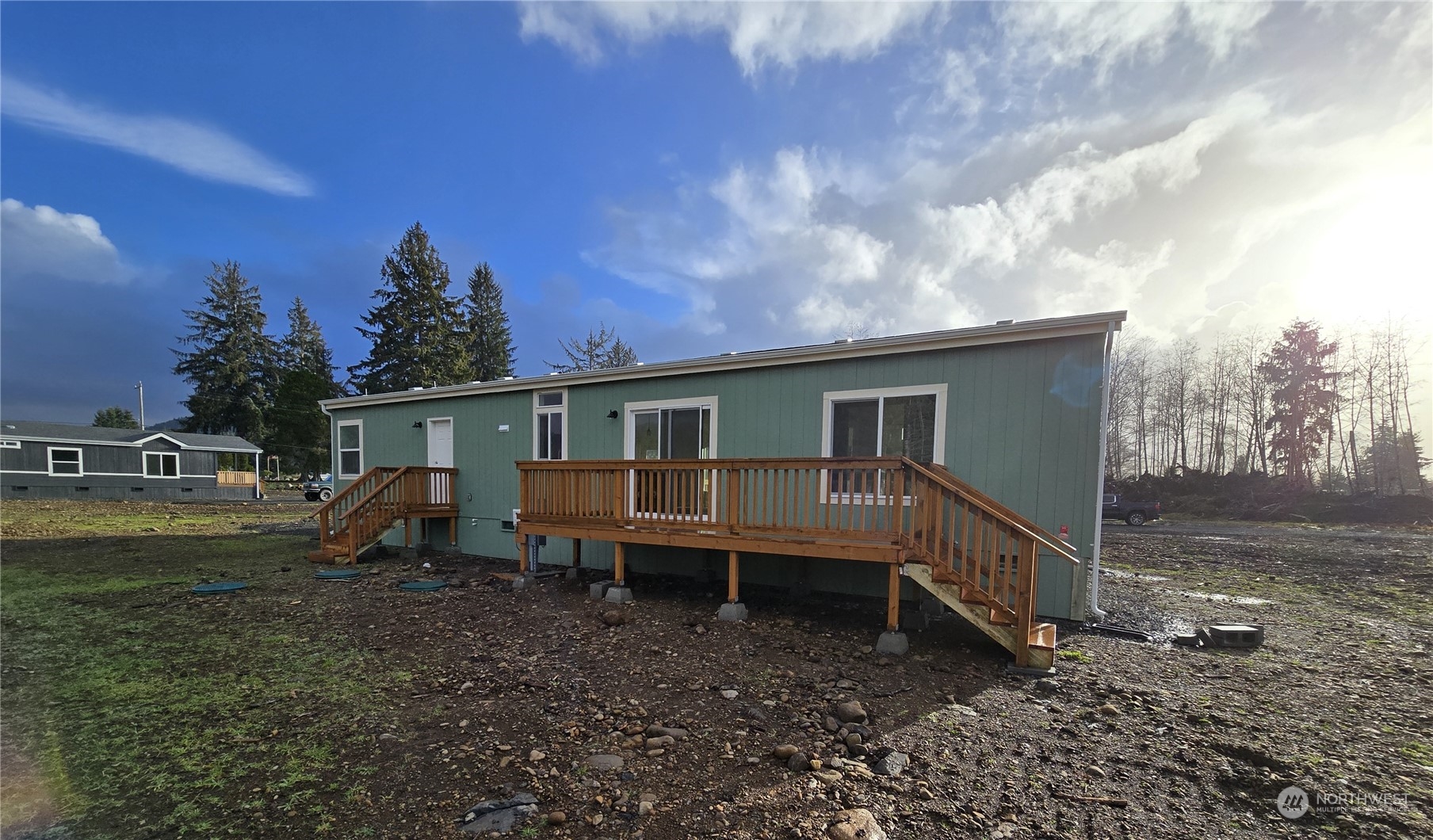 53 Newton Rd Forks Forks, WA 98331 - Photo 21 of 25 a view of a house with a yard and sitting area