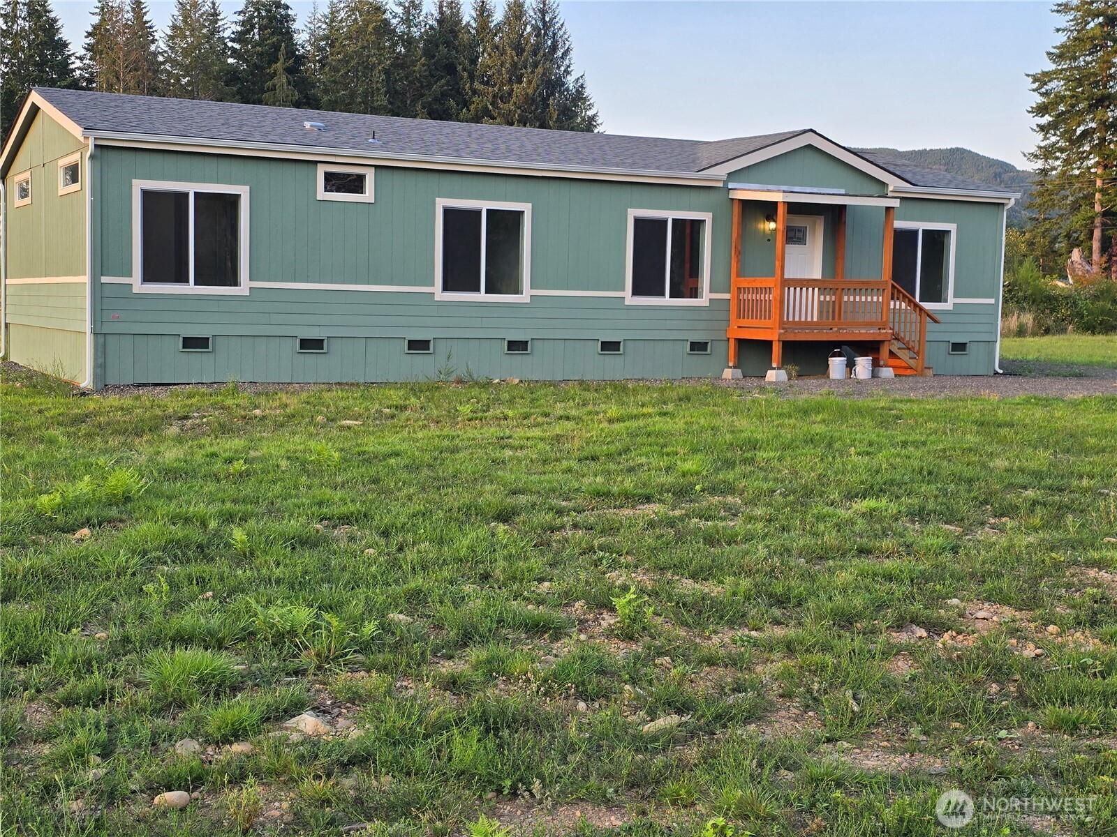 53 Newton Rd Forks Forks, WA 98331 - Photo 25 of 25 a front view of a house with yard