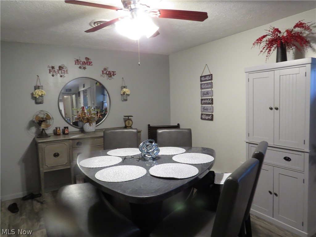 9811 Church Road Huron, OH 44839 - Photo 23 of 28 Dining space with ceiling fan and hardwood / wood-style floors