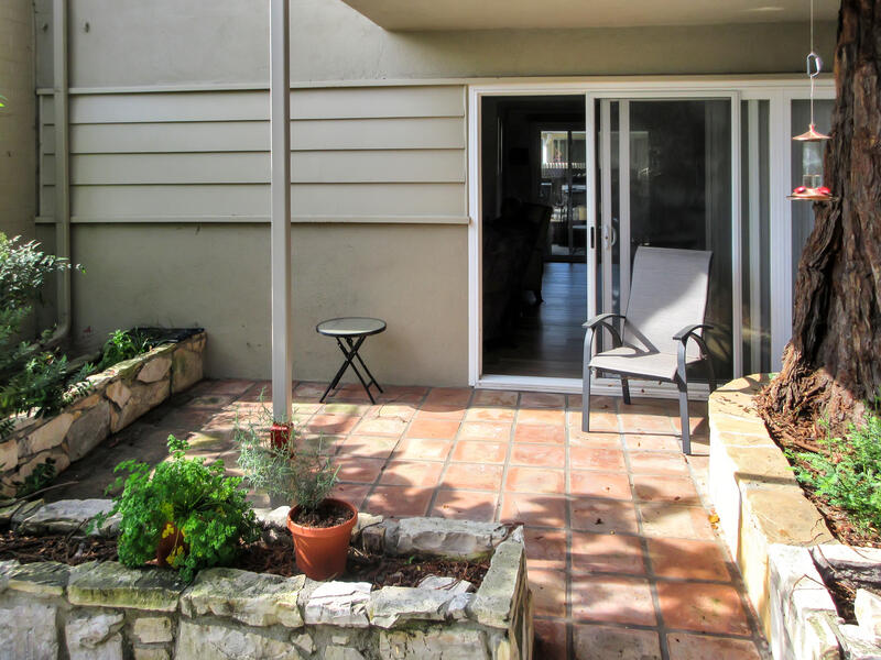5740 Encina Road, Unit 3 Goleta, CA 93117 - Photo 18 of 29 a view of a patio with table and chairs and potted plants