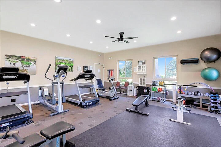 5740 Encina Road, Unit 3 Goleta, CA 93117 - Photo 23 of 25 a living room with furniture a window and gym equipment