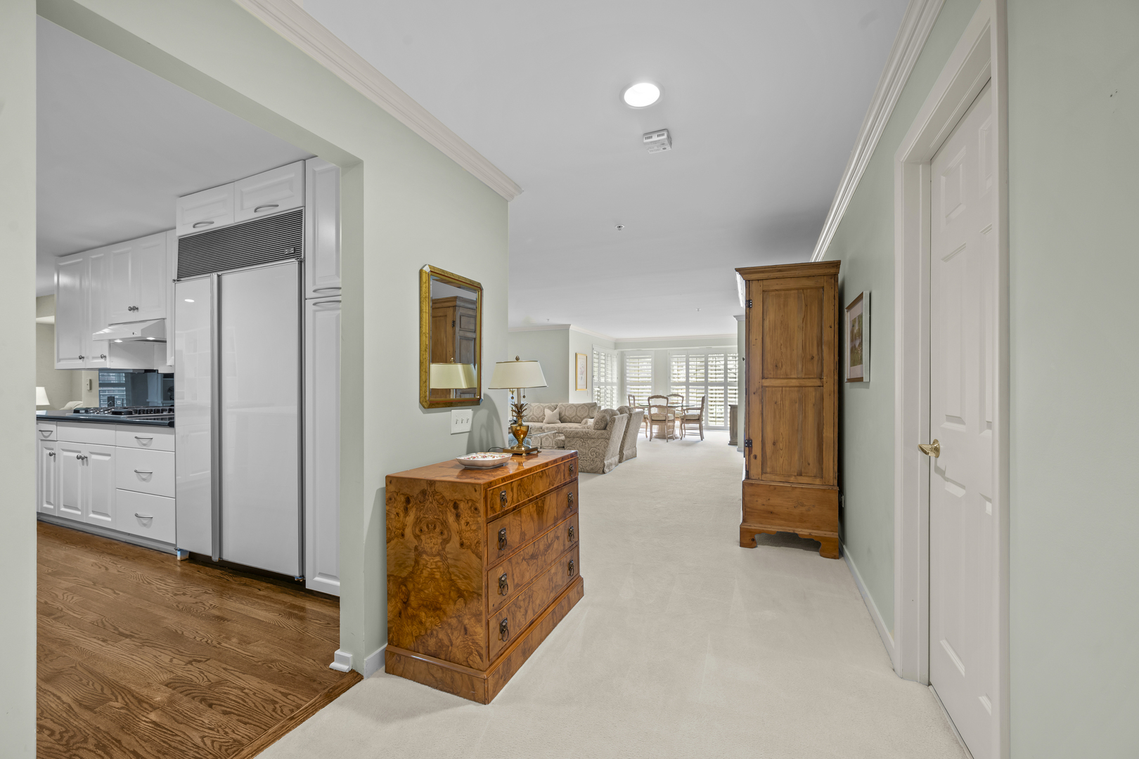 380 Green Bay Road, Unit 1B Winnetka, IL 60093 - Photo 3 of 19 a living room with furniture and a kitchen view
