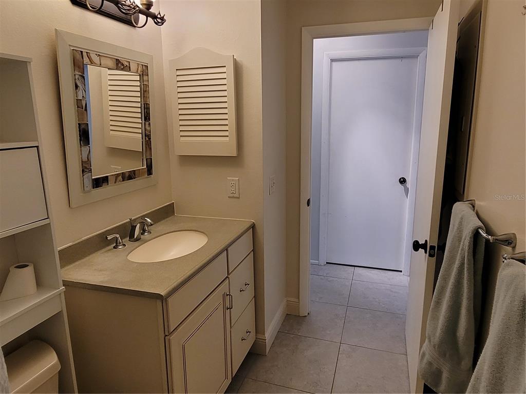 14447 Worthwhile Road Port Charlotte, FL 33953 - Photo 12 of 23 a bathroom with a sink and a mirror