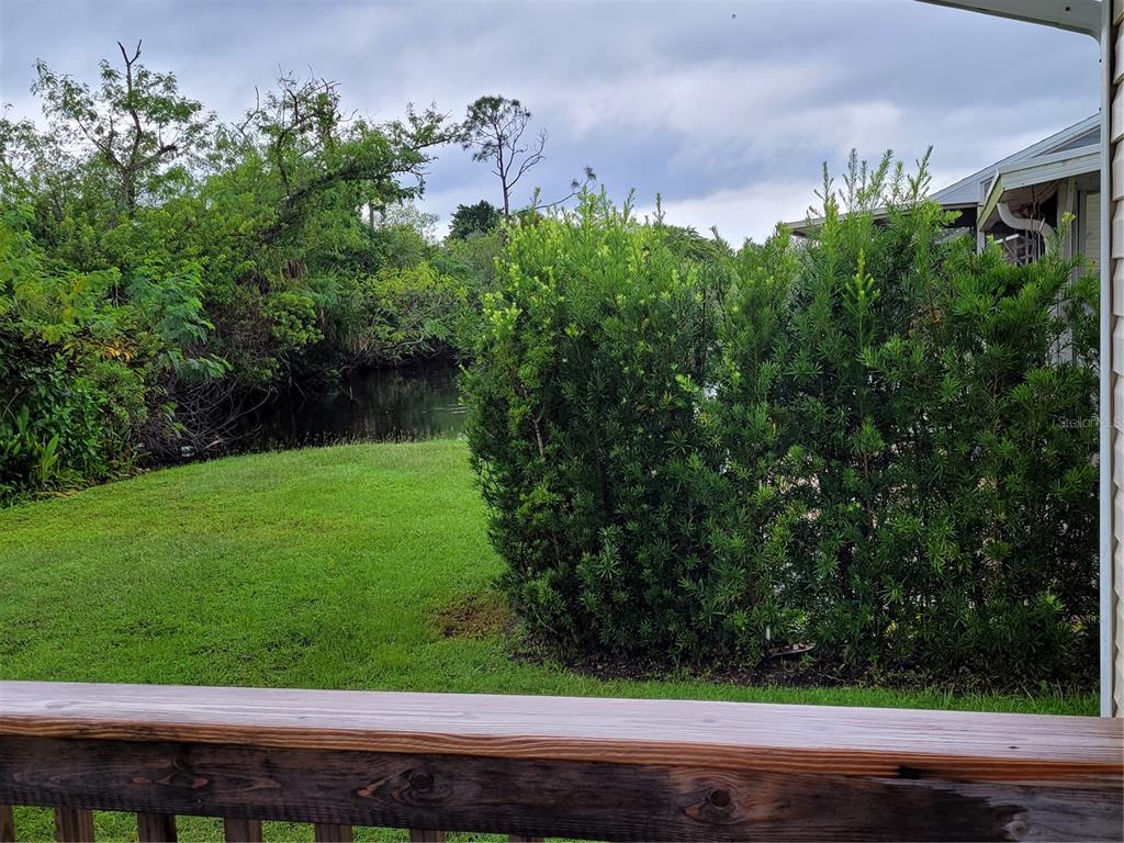 14447 Worthwhile Road Port Charlotte, FL 33953 - Photo 18 of 23 a view of a yard with potted plants