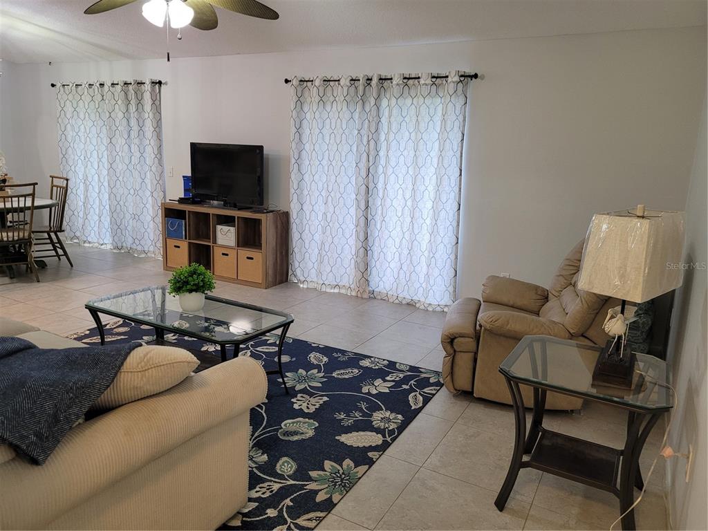 14447 Worthwhile Road Port Charlotte, FL 33953 - Photo 2 of 23 a living room with furniture and a flat screen tv