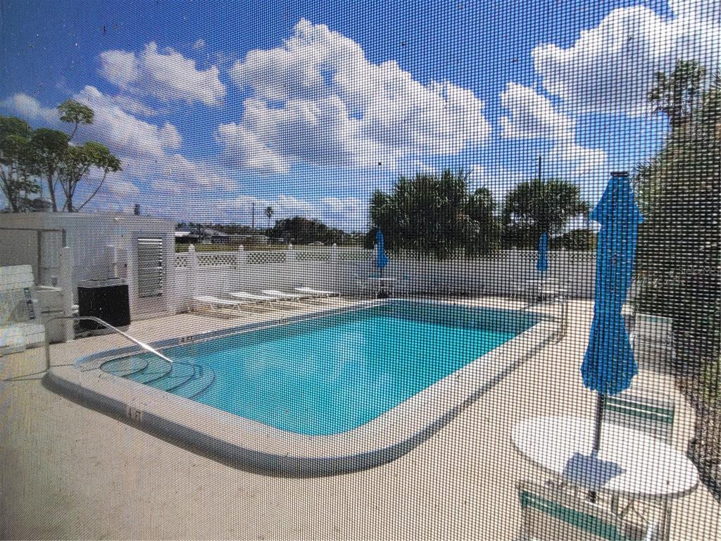 14447 Worthwhile Road Port Charlotte, FL 33953 - Photo 21 of 23 a view of a swimming pool with outdoor seating