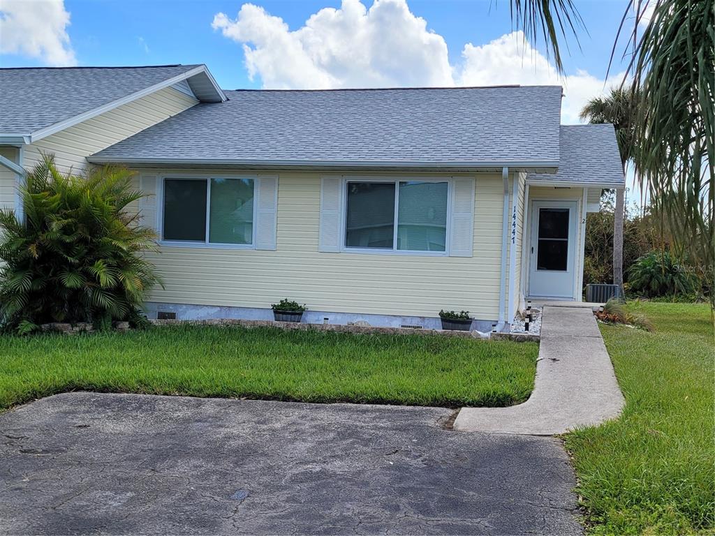 14447 Worthwhile Road Port Charlotte, FL 33953 - Photo 23 of 23 a front view of a house with a garden