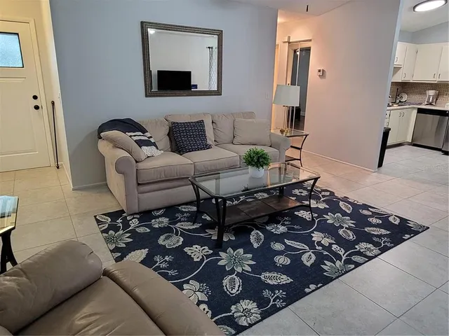a living room with furniture and a couch