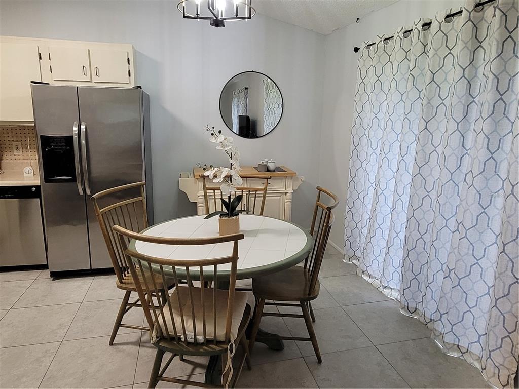 14447 Worthwhile Road Port Charlotte, FL 33953 - Photo 5 of 23 a dining room with furniture and window