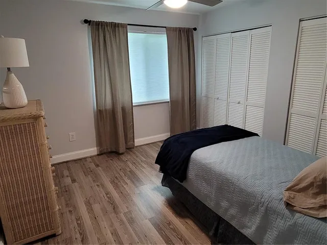 a bedroom with a bed and a mirror