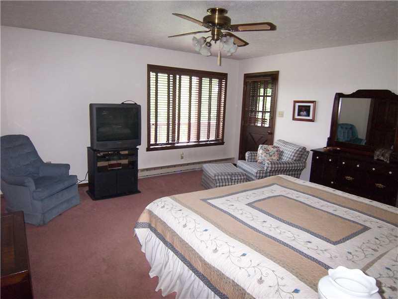 336 Beagle Club Road Washington, PA 15301 - Photo 4 of 17 Master Bedroom. At 16 x15 there s room for your king size furniture, and you ll love the large walk in closet. Door to a deck to the right where you can enjoy the view of your land.