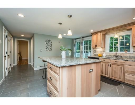 5 J Hammond Road Charlton, MA 01507 - Photo 8 of 33 a kitchen with granite countertop a sink and cabinets