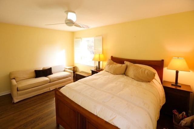 451 Shenstone Road Riverside, IL 60546 - Photo 14 of 22 a spacious bedroom with two beds and a lamp