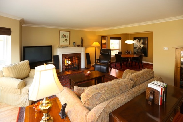 451 Shenstone Road Riverside, IL 60546 - Photo 3 of 22 a living room with furniture fireplace and flat screen tv