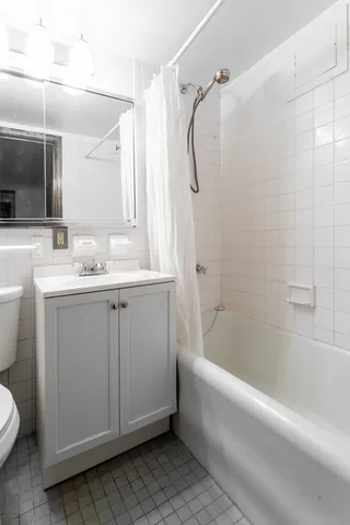 a kitchen with stainless steel appliances a sink stove and cabinets