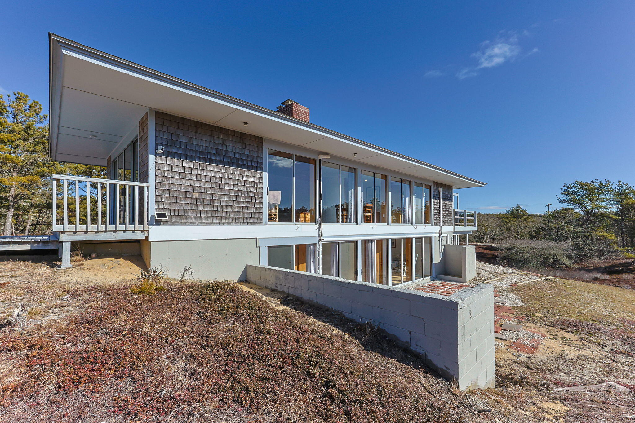 2 Cobb Road Truro, MA 02666 - Photo 1 of 38 a view of a house with wooden floor next to a road