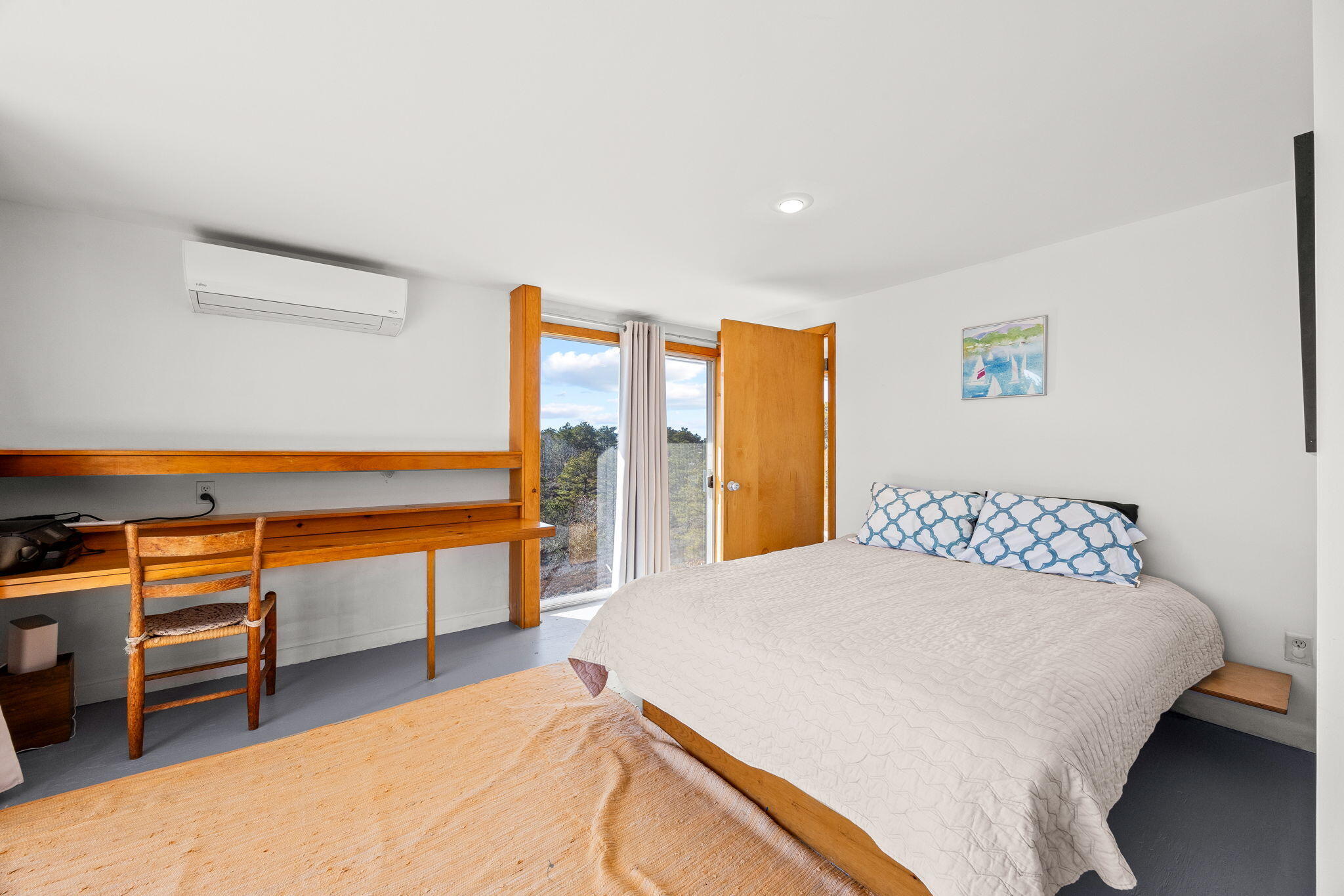 2 Cobb Road Truro, MA 02666 - Photo 17 of 38 a spacious bedroom with a bed and a walk in closet