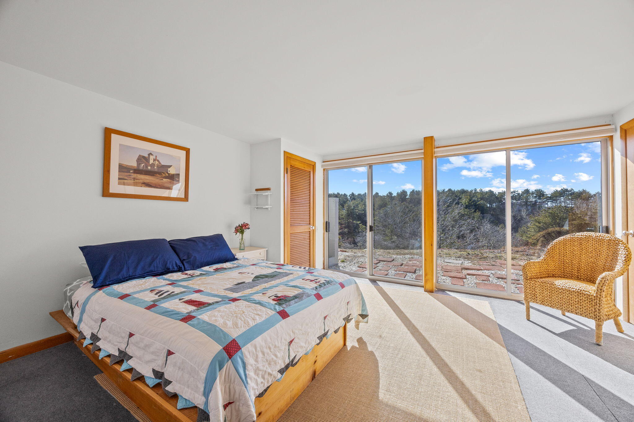 2 Cobb Road Truro, MA 02666 - Photo 19 of 38 a bedroom with a large bed and a large window