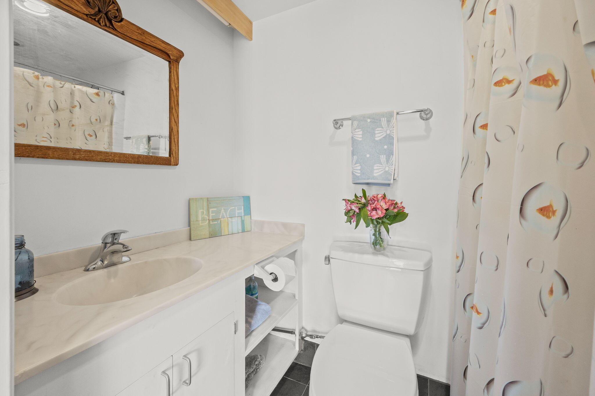 2 Cobb Road Truro, MA 02666 - Photo 21 of 38 a bathroom with a sink mirror and toilet