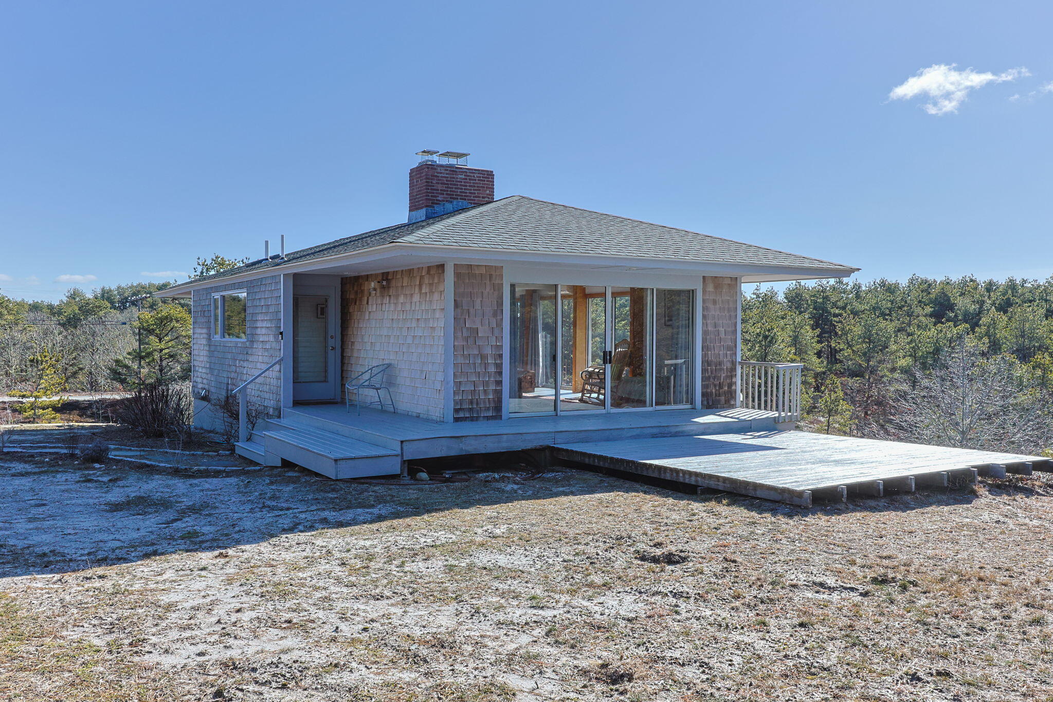 2 Cobb Road Truro, MA 02666 - Photo 3 of 38 a front view of a house with a yard