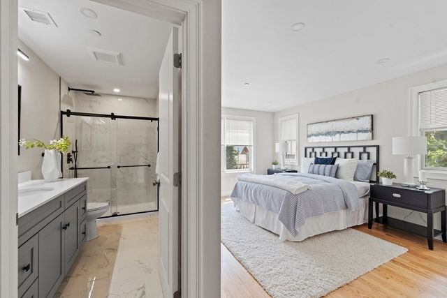 a bedroom with a large bed and a window