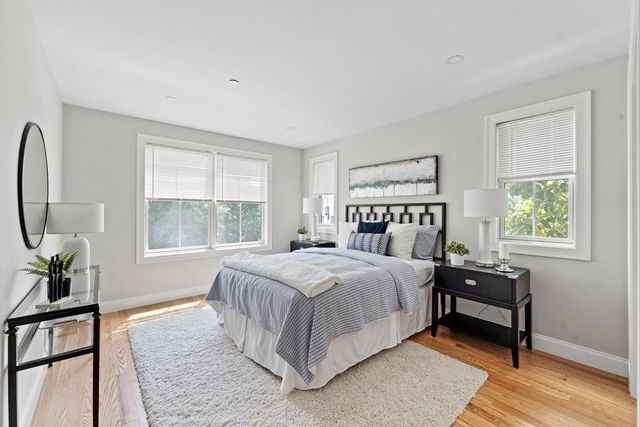 a bed room with a bed and a night stand