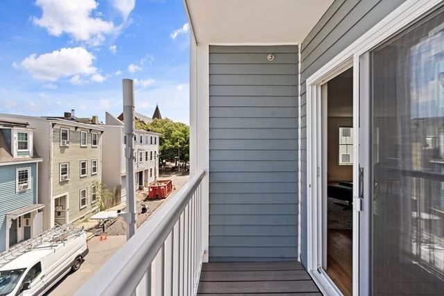 a bedroom with a bed and lamps