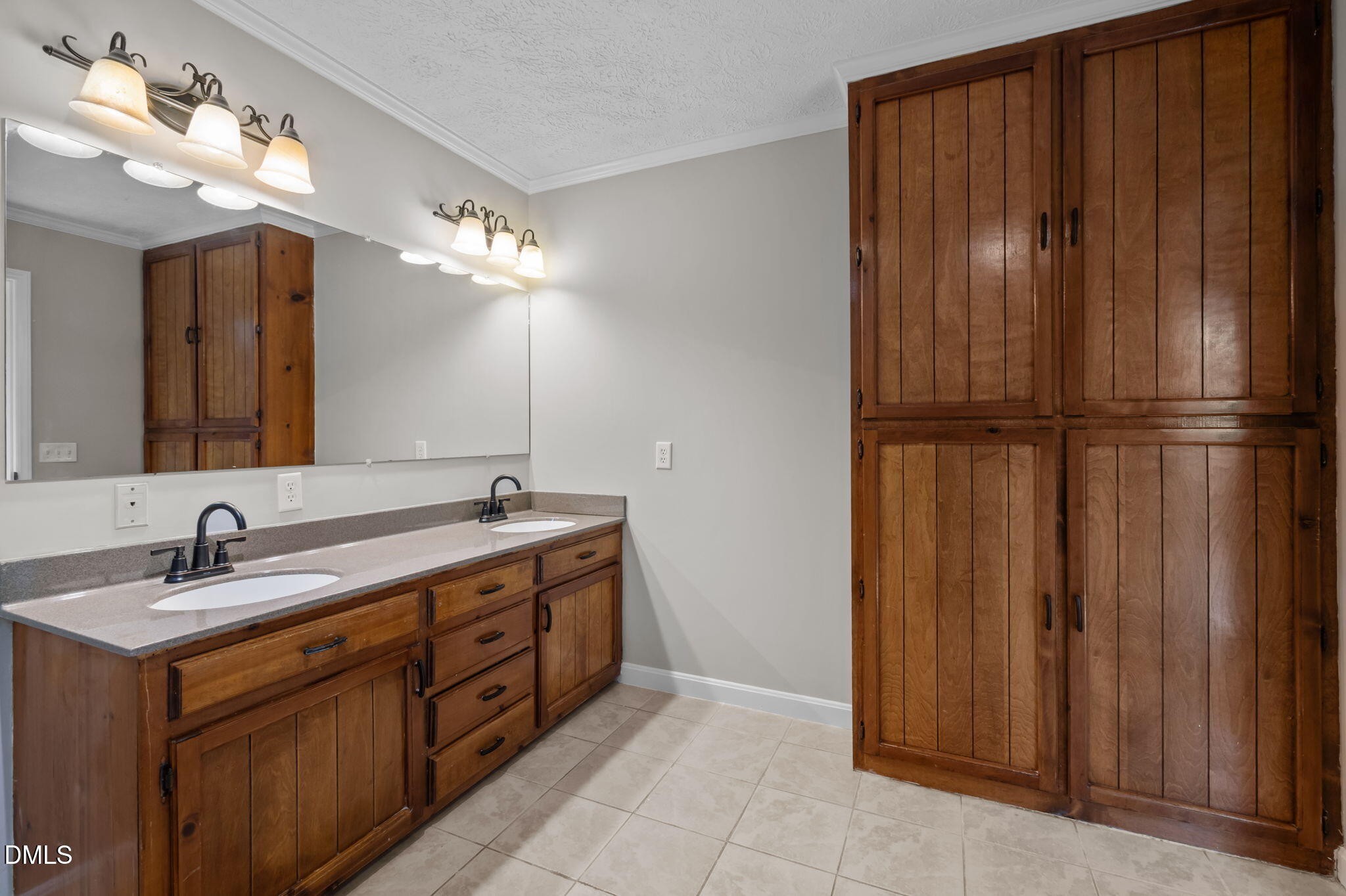 205 Roxdale Place Roxboro, NC 27574 - Photo 27 of 50 a bathroom with a double vanity sink and a mirror