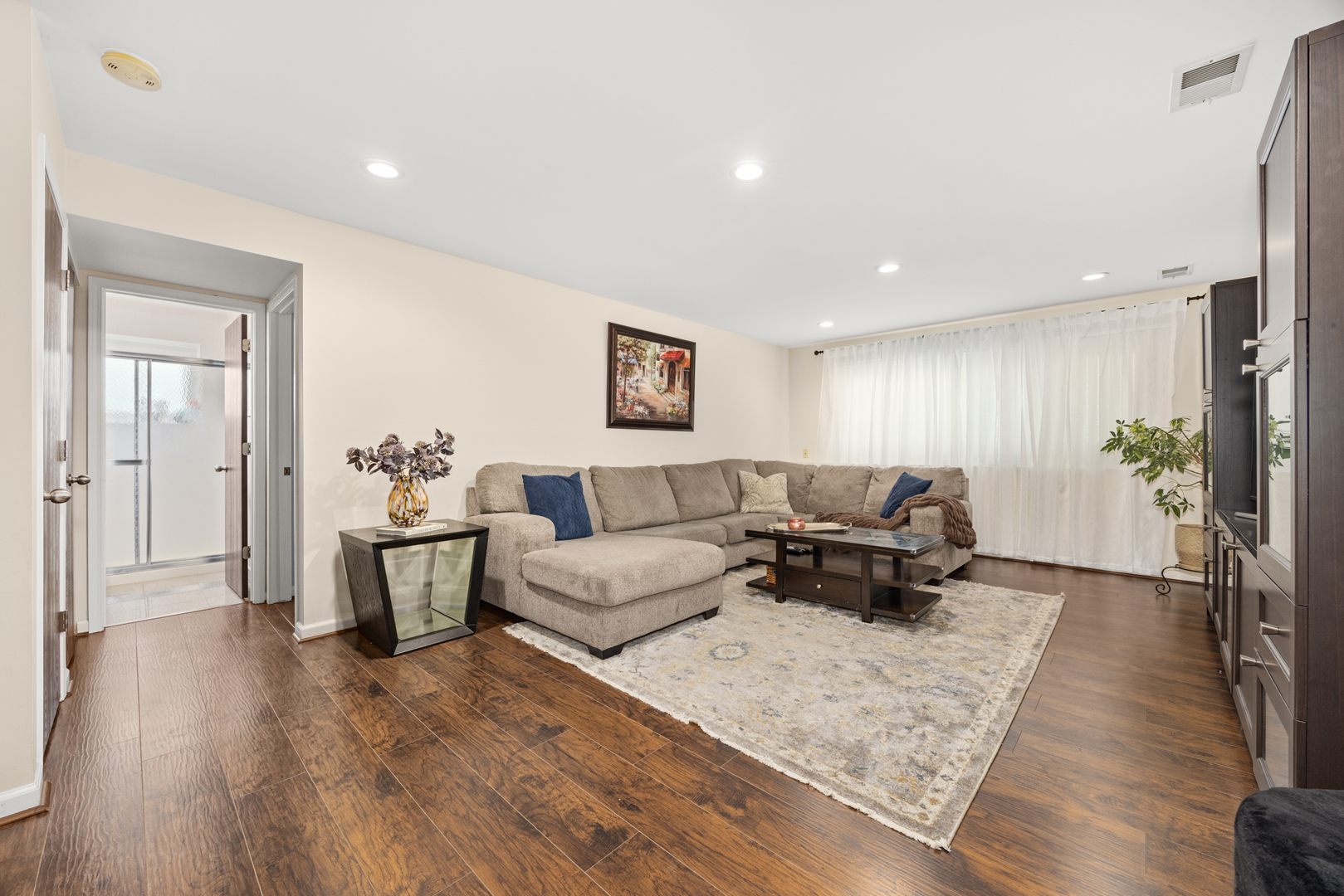 2148 Cimarron Way Addison, IL 60101 - Photo 17 of 32 a living room with furniture and a wooden floor