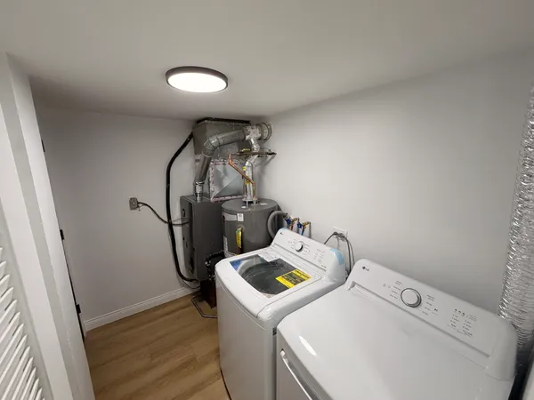 a utility room with dryer and washer
