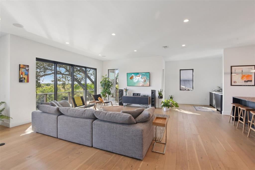 4828 West Flamingo Road Tampa, FL 33611 - Photo 11 of 67 a living room with furniture and a large window