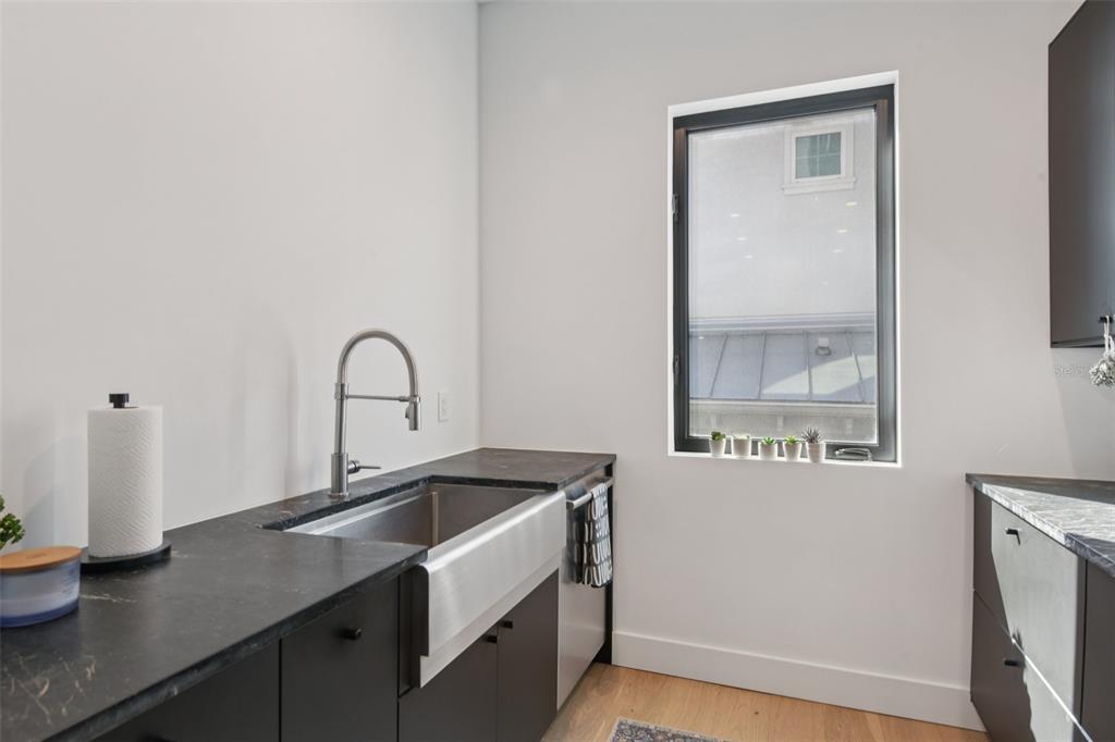 4828 West Flamingo Road Tampa, FL 33611 - Photo 19 of 67 a kitchen with a sink and a window