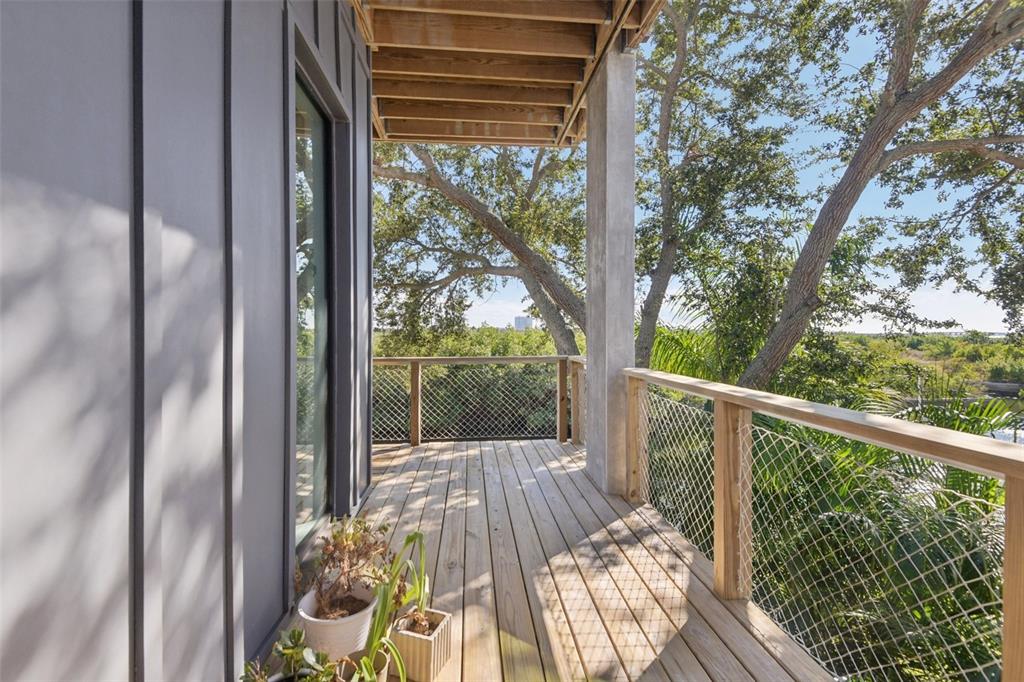 4828 West Flamingo Road Tampa, FL 33611 - Photo 22 of 67 a view of balcony with wooden floor