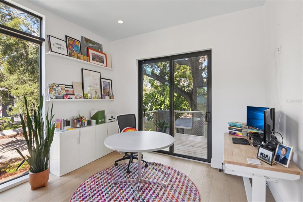 4828 West Flamingo Road Tampa, FL 33611 - Photo 23 of 67 a living room with furniture a window and a potted plant