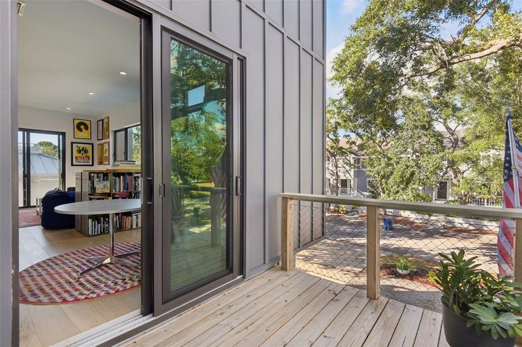 4828 West Flamingo Road Tampa, FL 33611 - Photo 24 of 67 a view of balcony with wooden floor