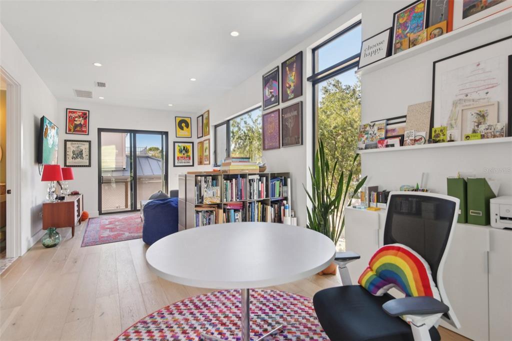 4828 West Flamingo Road Tampa, FL 33611 - Photo 25 of 67 a living room with lots of furniture and a large window