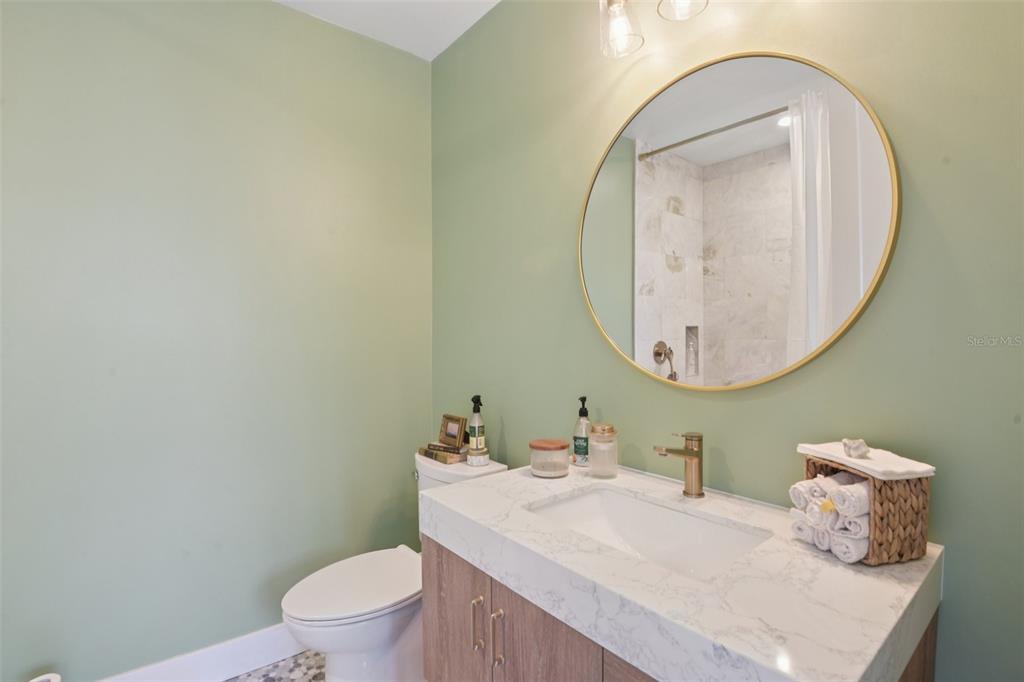 4828 West Flamingo Road Tampa, FL 33611 - Photo 29 of 67 a bathroom with a sink and a mirror