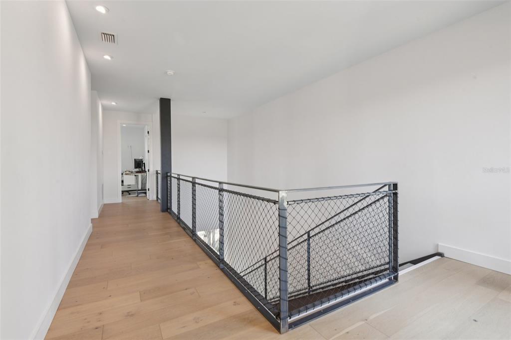 4828 West Flamingo Road Tampa, FL 33611 - Photo 30 of 67 a view of a hallway with staircase