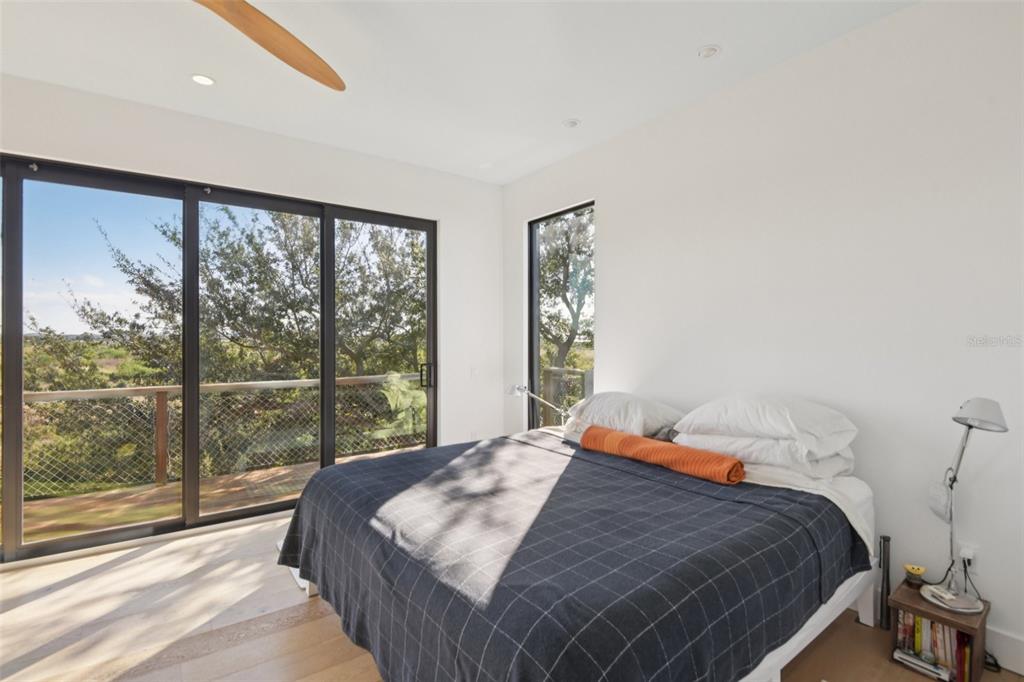 4828 West Flamingo Road Tampa, FL 33611 - Photo 32 of 67 a bedroom with a large bed and a large window