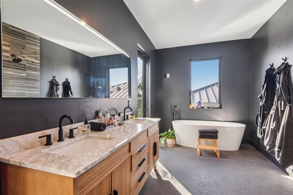 4828 West Flamingo Road Tampa, FL 33611 - Photo 37 of 67 a bathroom with a sink and a mirror