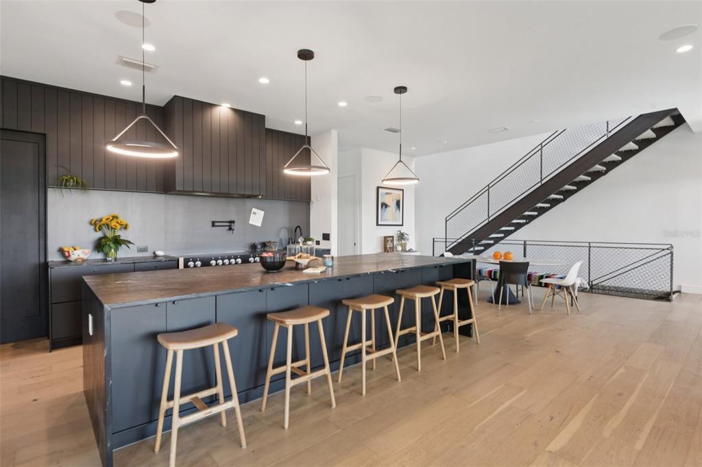 4828 West Flamingo Road Tampa, FL 33611 - Photo 4 of 67 a large kitchen with a table and chairs