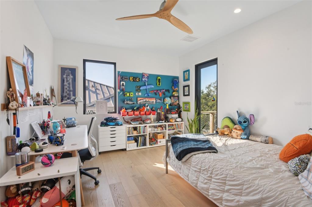 4828 West Flamingo Road Tampa, FL 33611 - Photo 41 of 67 a bedroom with furniture and a bed