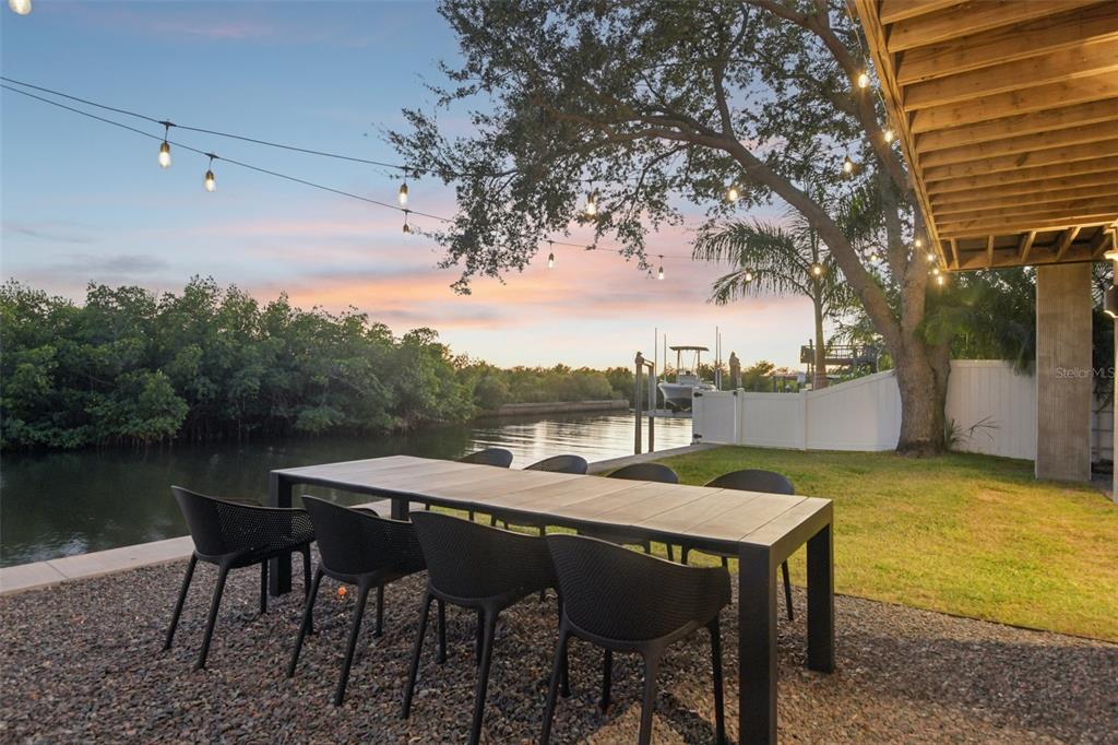 4828 West Flamingo Road Tampa, FL 33611 - Photo 67 of 67 a view of a dinning table and chairs in patio
