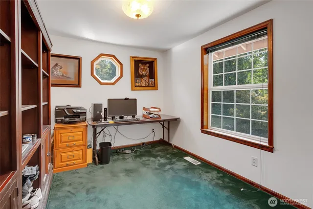 a room with window and a chair