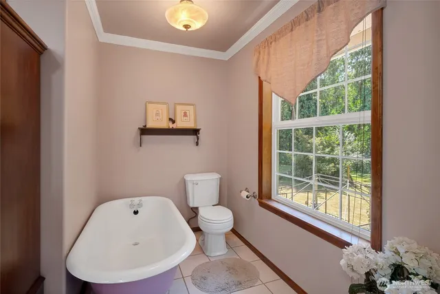 a bathroom with a toilet and a sink