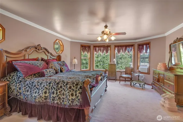 a bed room with a bed and a chair