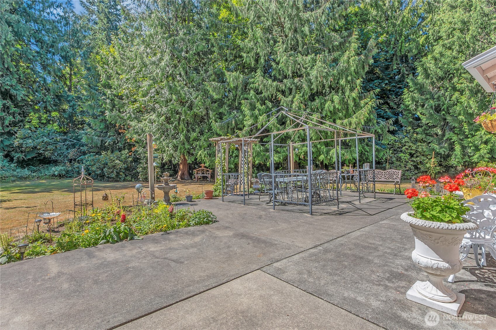 27210 145th Street East Buckley, WA 98321 - Photo 26 of 31 a view of a patio with plants and a garden